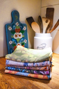 a stack of towels on a wooden counter